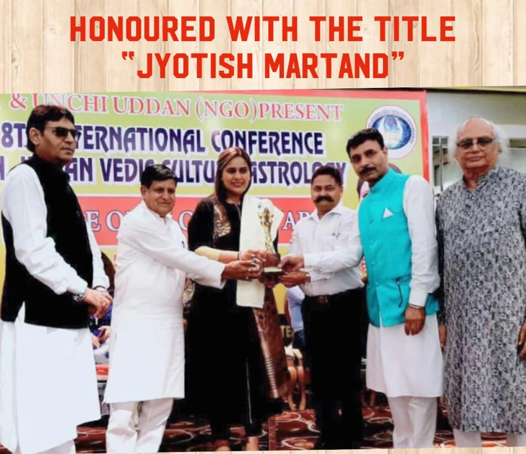 An award presentation at a Jyotish Martand event.
