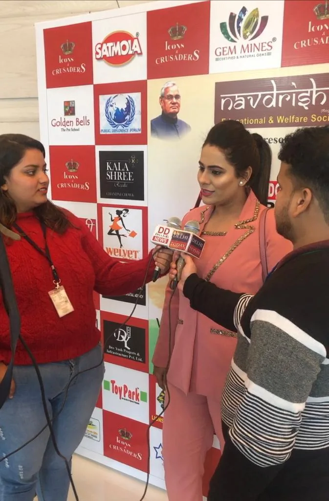 A conversation at an event booth.